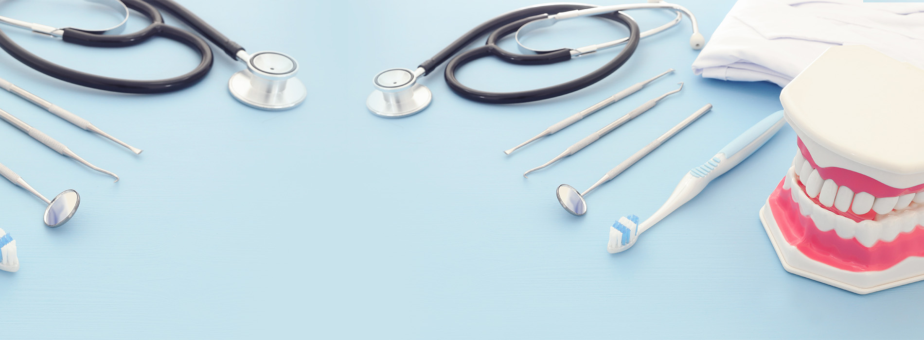 This is a composite image showing medical equipment and supplies, including a stethoscope, blood pressure cuff, tongue depressors, and other instruments, arranged in a manner that suggests they are part of a medical examination or procedure. The background is a solid color to emphasize the items.