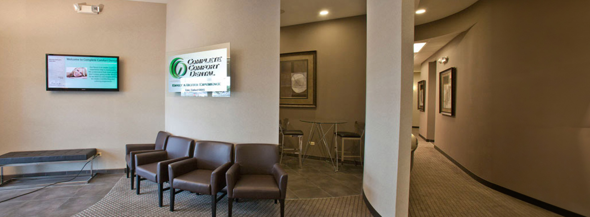 The image shows a modern dental clinic interior with various pieces of equipment, including a dental chair and an X-ray machine.